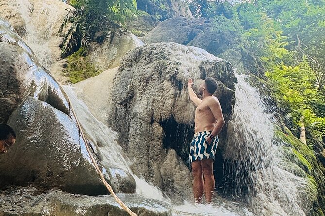 7 Hour Sticky Waterfall and Zipline Adventure - Climbing the limestone at Bua Thong Falls