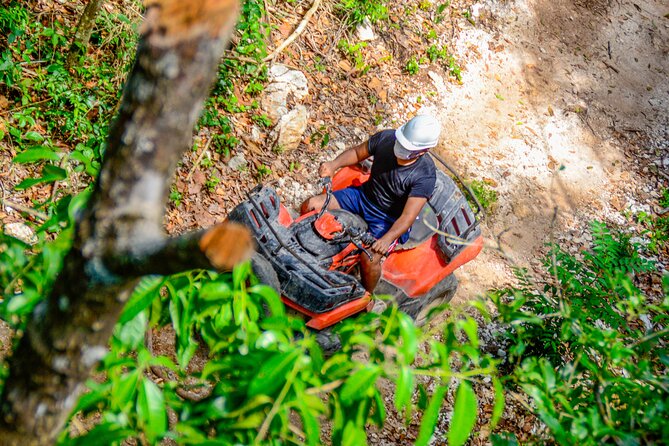 Action-packed Cancun ATV tour, Ziplines, Cenote, Lunch and More - Cooling off in a natural cenote