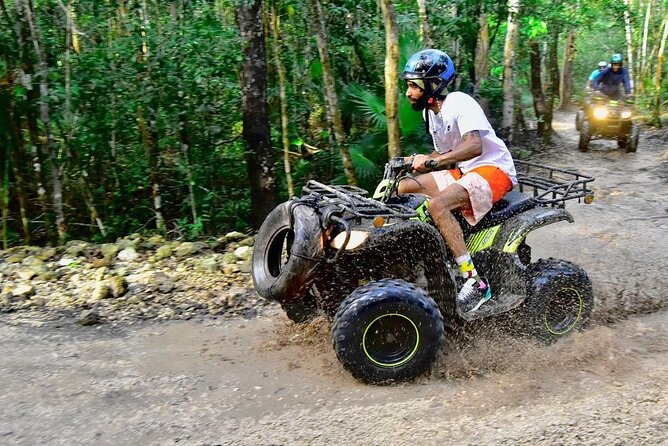 Amazing ATV (single) Cenote and Ziplines with Transfer from Playa del Carmen - Single ATVs on a dusty jungle trail