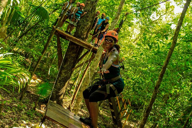 Amazing ATV Tour, Ziplines and Cenote Swim with Lunch and round trip included - Riding a Honda or Yamaha ATV on rough ground