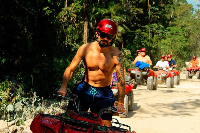 ATV Cenote and Zipline Adventure from Tulum - Entering a semi-dry cenote by natural light