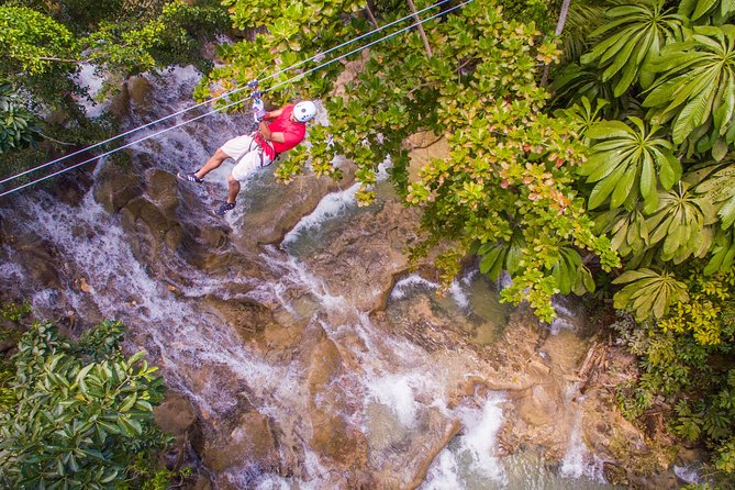 ATV, Horseback Ride, Zipline, Falls Climb + Lunch from Ocho Rios - ATV riding on rough Jamaican trails