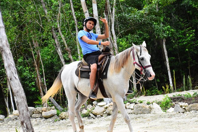 ATV (shared), Horse Back Riding, Ziplines, & Cenote from Cancún - Horseback riding through the tropical setting