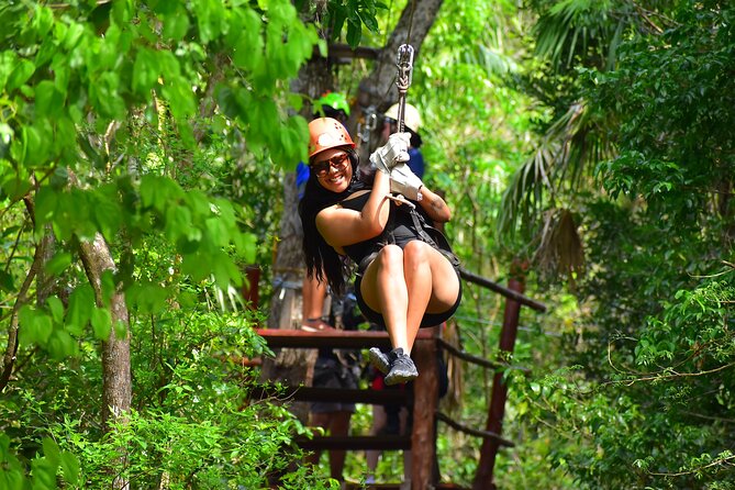 ATV Tour with Cenote swim, Ziplines, Transportation and Lunch Included - Swimming in a Mayan cenote
