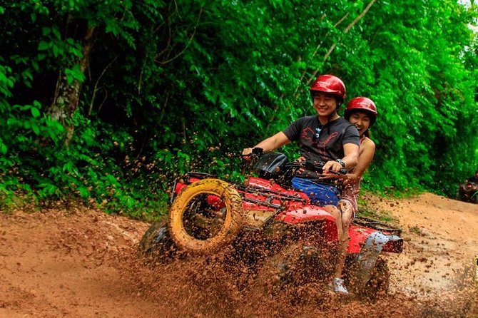 ATV Tour with Cenote swim, Ziplines, Transportation and Lunch Included - Ziplining through the trees
