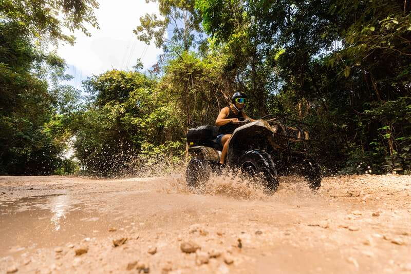 Cancun: Jungle ATV Tour, Ziplining, and Cenote Swim - Three ziplines above the trees