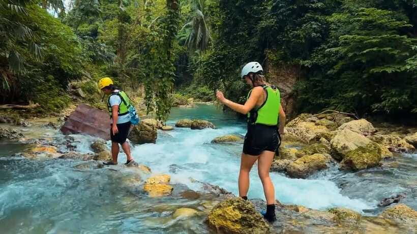 Cebu: Kawasan Falls Canyoneering Tour with Ziplining & Lunch - Filipino lunch with a sea view at Ambak Base Camp