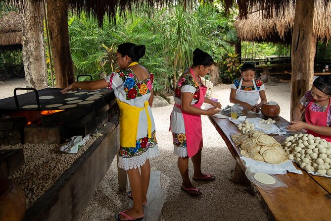 Cenote Tankah and Mayan Village Tour with Zipline, Canoes & Lunch - Canoeing across turquoise water