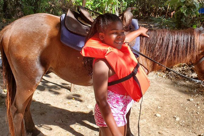 Dunn's River Falls Climb, Zipline and Horseback Riding Private Tour - Ziplining above the Jamaican trees