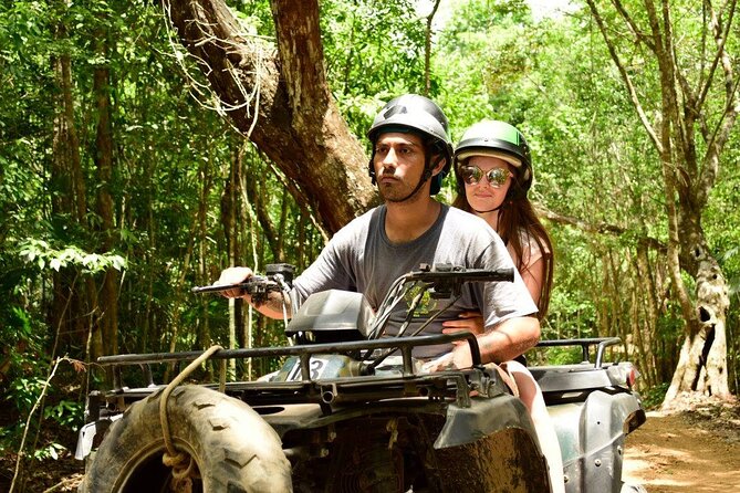 Experience ATV (shared) Ziplines & Cenote with Lunch from Cancún - ATV riding over rough jungle paths