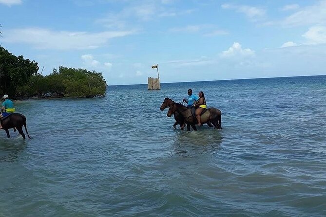 Horseback Riding, ATV and Ocean Zip lining combo from Montego Bay - Riding a horse from beach to sea