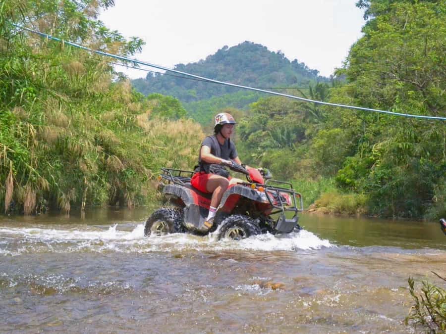 KhaoLak:ATV, ZipLine, & Rafting Adventure Monkey Cave Temple - A 200-meter zipline through the treetops