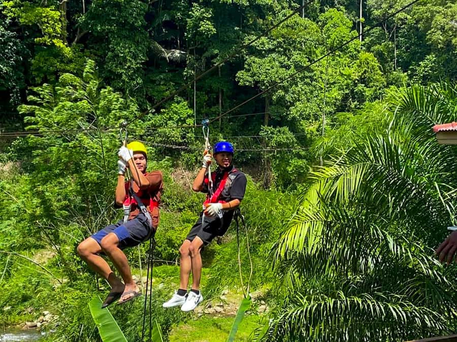 KhaoLak:ATV, ZipLine, & Rafting Adventure Monkey Cave Temple - ATV riding through green terrain