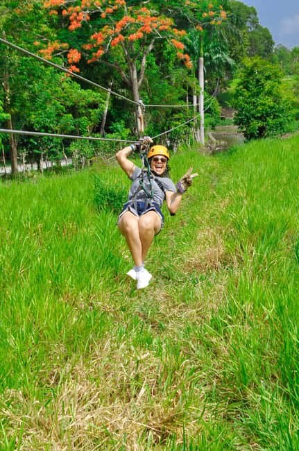 Puerto Plata: Buggy, Zip Line, Waterfalls, and Lunch Combo - Zip lines above the tropical setting