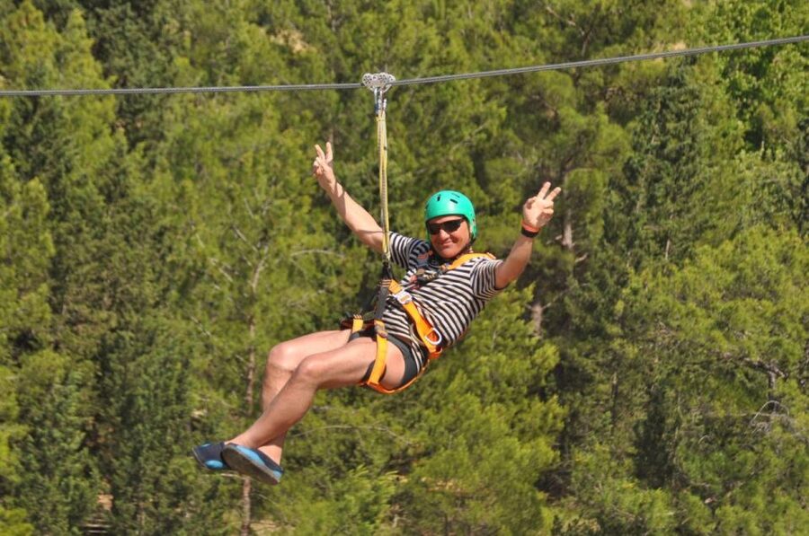Rafting, Quad or Buggy Ride, Zipline, Jeep Tour Super Combo - Ziplining above the canyon