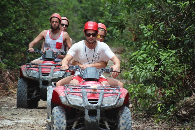 The best ATVs, zipline, cenote tour with lunch and transportation - Swimming in two cenotes