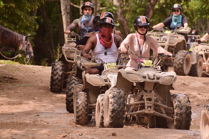 Tulum Adrenaline Tour ATV Ziplines and Cenote Swim Day - Taking an ATV onto the jungle trails